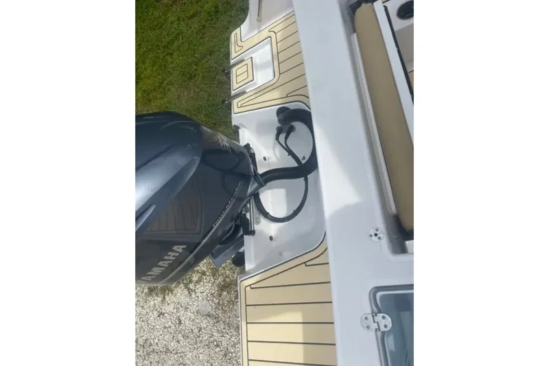 Slide: The Image of 2021 Sportsman Open 242 Center Console boat with Yamaha outboard motor. - 14