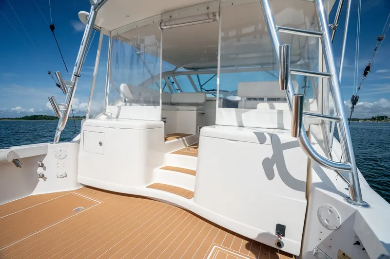 Slide: The Image of 2011 Cabo 36 Express yacht deck with seating and ocean view. - 23
