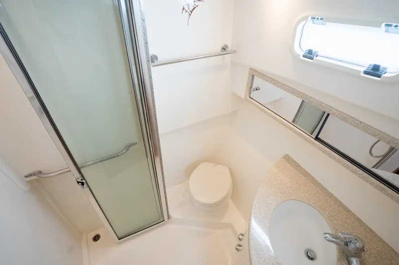Slide: The Image of Bathroom interior of 2011 Cabo 36 Express yacht with shower, toilet, and sink. - 42