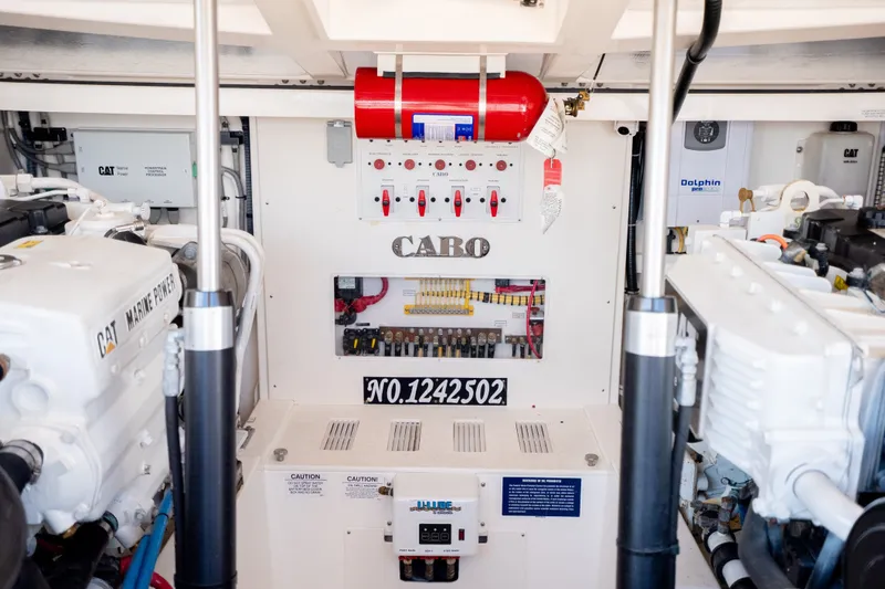 Slide: The Image of Engine room of a 2011 Cabo 36 Express boat, featuring CAT Marine Power engines. - 45