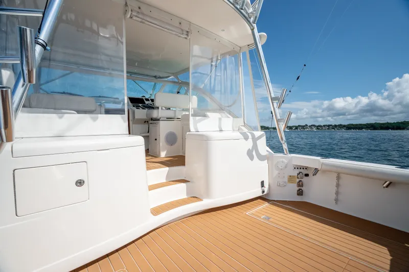 Slide: The Image of 2011 Cabo 36 Express yacht deck with ocean view and clear skies. - 25