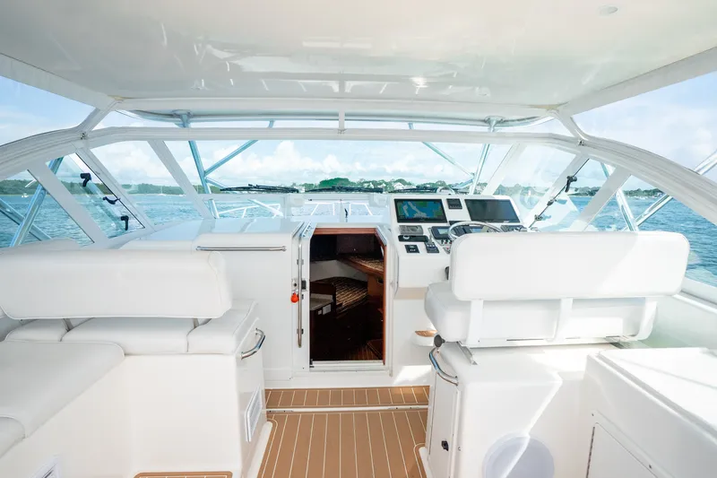 Slide: The Image of Interior view of 2011 Cabo 36 Express yacht cockpit with navigation equipment. - 29