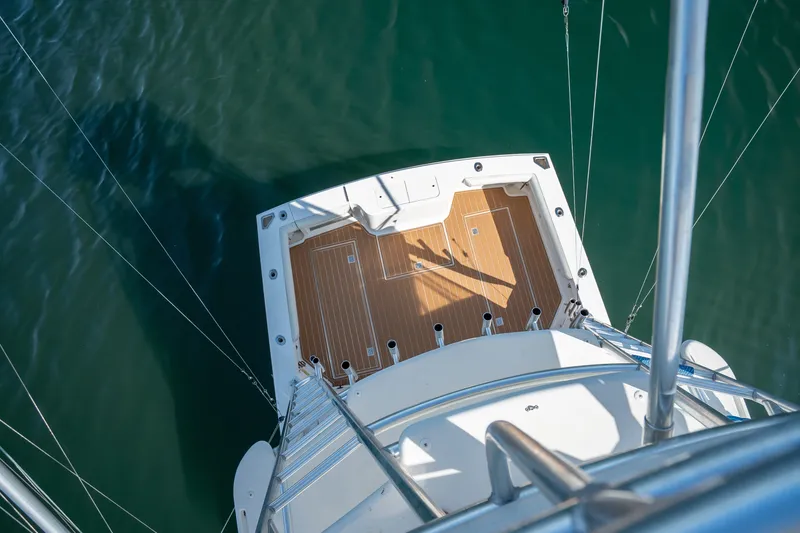 Slide: The Image of Overhead view of 2011 Cabo 36 Express boat deck on calm water. - 21