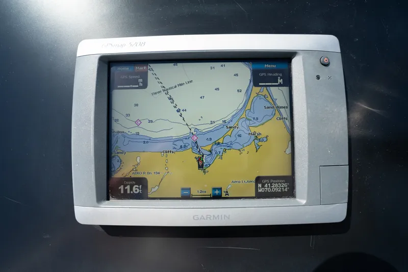 Slide: The Image of Garmin GPS display on 2011 Cabo 36 Express boat, showing nautical map and coordinates. - 20