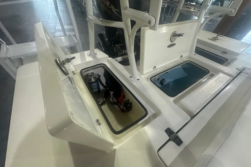 Slide: The Image of 2024 Hewes Redfisher 16 boat compartments with storage and equipment. - 10