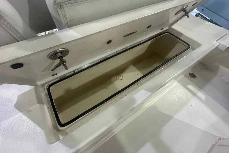 Slide: The Image of Open storage compartment on 2024 Hewes Redfisher 16 boat, showcasing interior space. - 13