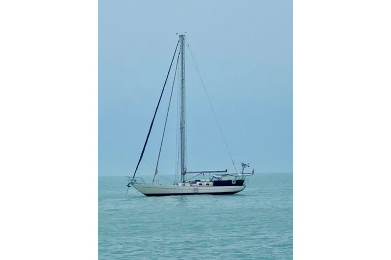 Slide: The Image of Sailboat on calm sea, Reliance 44 model, 2011, under clear blue sky. - 61