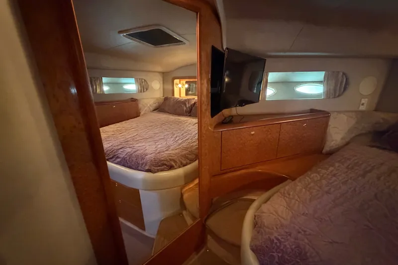 Slide: The Image of Luxurious cabin interior of 1997 Sea Ray 400 Sedan Bridge yacht. - 23