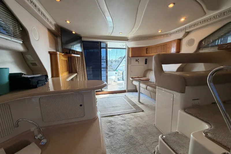 Slide: The Image of 1997 Sea Ray 400 Sedan Bridge interior with modern amenities and elegant design. - 17