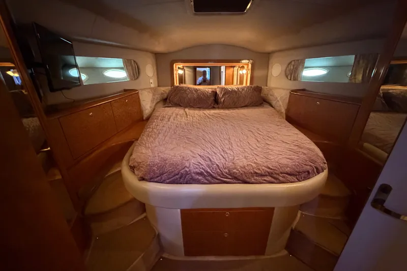 Slide: The Image of Luxurious bedroom interior of 1997 Sea Ray 400 Sedan Bridge yacht. - 22