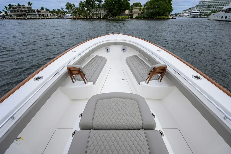 Slide: The Image of 2022 Valhalla V-37 boat interior with luxurious seating and waterfront view. - 46