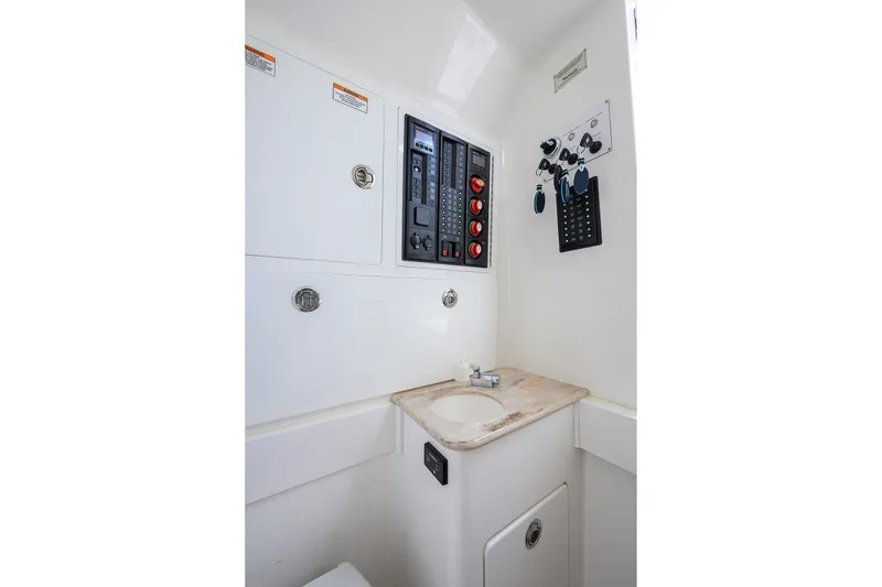 Slide: The Image of 2022 Valhalla V-37 boat interior with control panel and sink. - 62