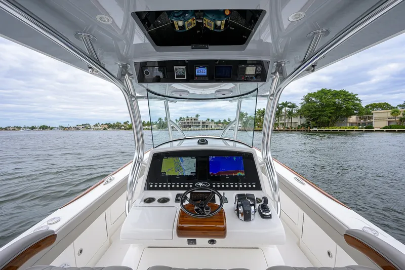 Slide: The Image of Cockpit view of 2022 Valhalla V-37 boat with advanced navigation system on a calm waterway. - 36