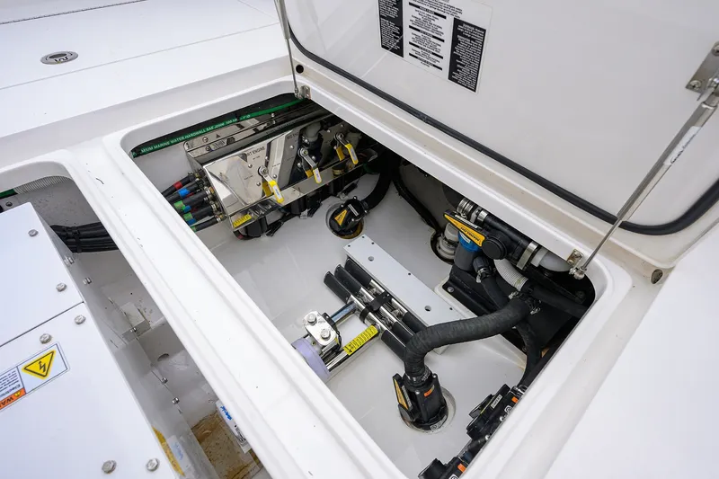 Slide: The Image of Engine compartment of 2022 Valhalla V-37 boat, showcasing mechanical components and wiring. - 28