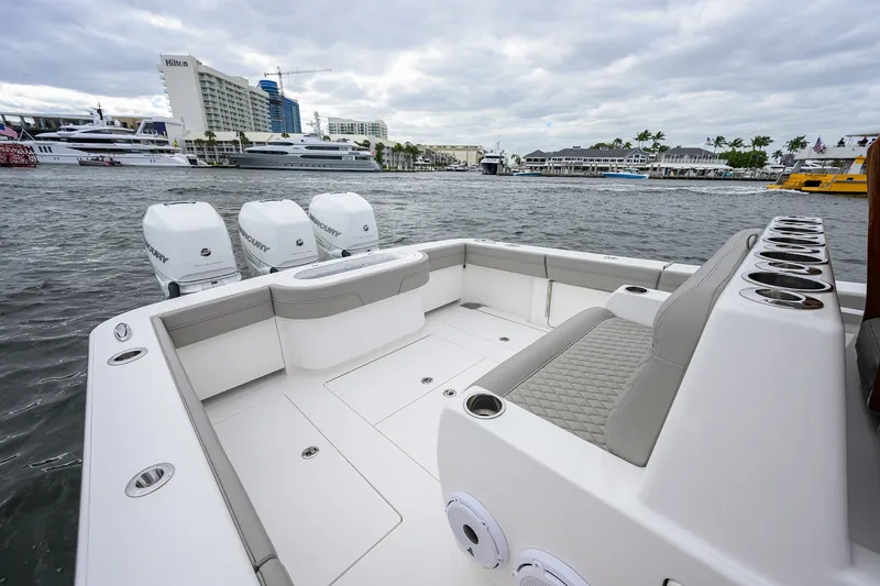 Slide: The Image of 2022 Valhalla V-37 boat with triple Mercury engines docked in a marina. - 18