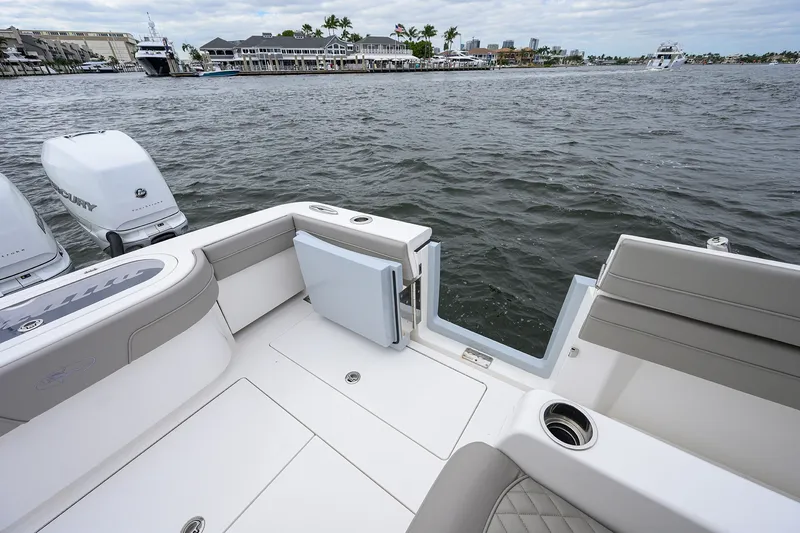 Slide: The Image of 2022 Valhalla V-37 boat interior with open water view and docked yachts. - 22