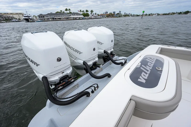 Slide: The Image of 2022 Valhalla V-37 boat with triple Mercury outboard engines on water. - 15