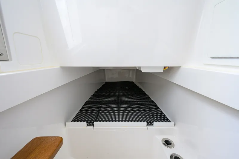 Slide: The Image of 2022 Valhalla V-37 boat interior storage compartment with non-slip flooring. - 60