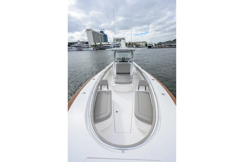 Slide: The Image of 2022 Valhalla V-37 boat with sleek design, docked in a marina. - 51