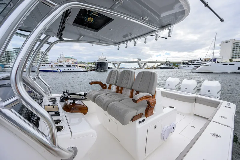 Slide: The Image of 2022 Valhalla V-37 boat interior with luxury seating and waterfront view. - 41