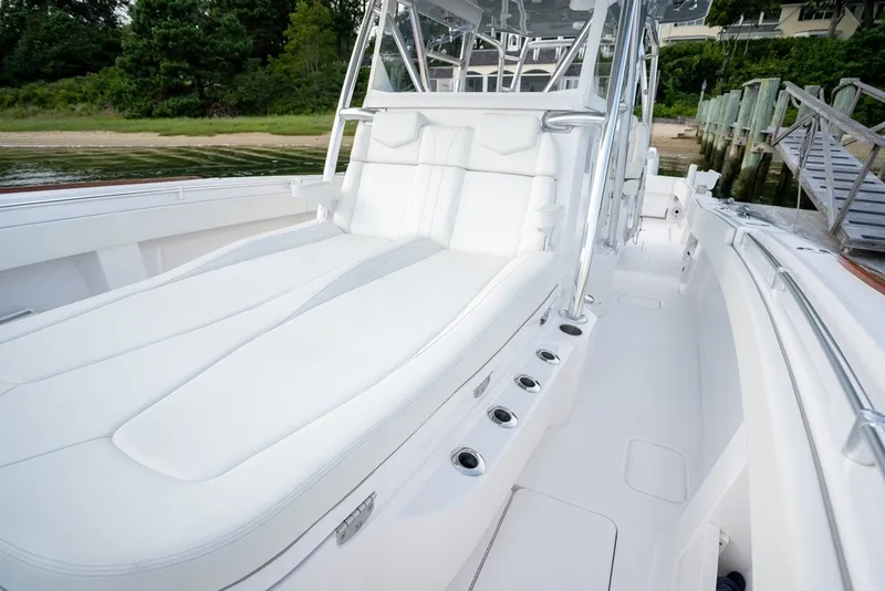 Slide: The Image of 2023 Invincible 39 Open Fisherman boat with luxurious white seating and sleek design. - 18