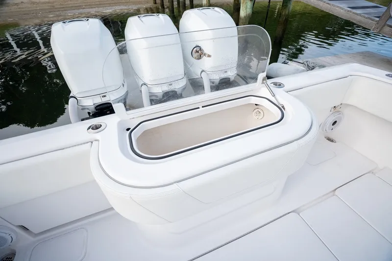 Slide: The Image of 2023 Invincible 39 Open Fisherman boat with triple outboard engines and a central livewell. - 14
