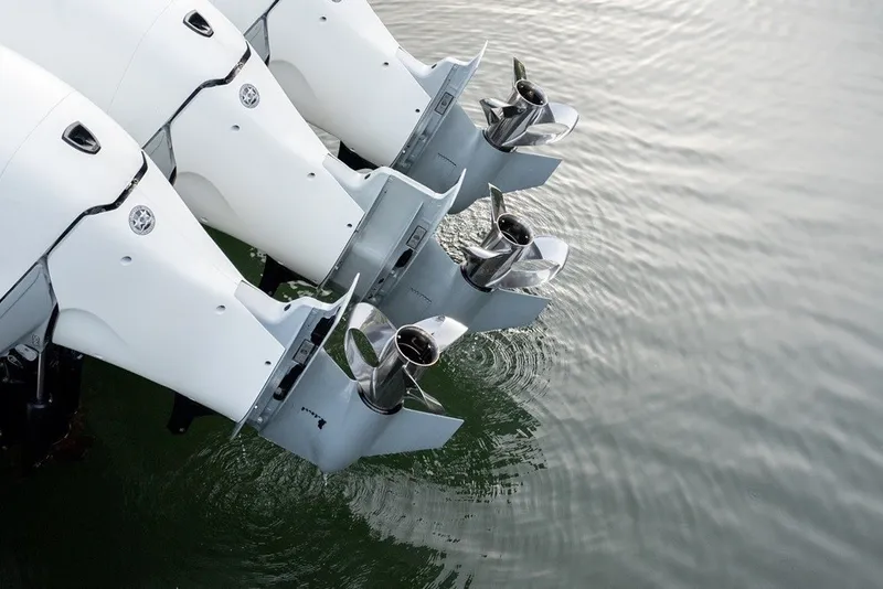 Slide: The Image of Triple outboard motors on 2023 Invincible 39 Open Fisherman boat in water. - 26