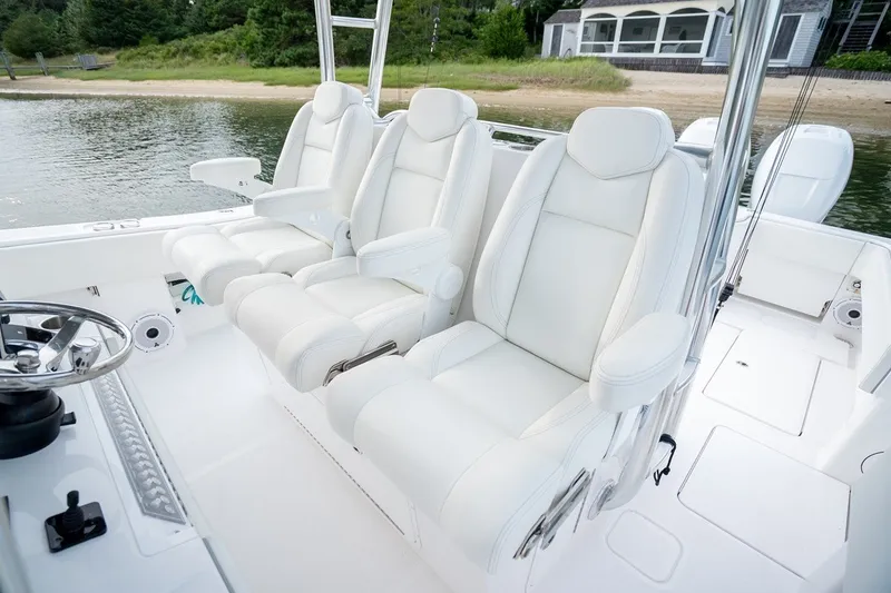 Slide: The Image of Luxurious seating on 2023 Invincible 39 Open Fisherman boat, featuring plush white upholstery. - 28