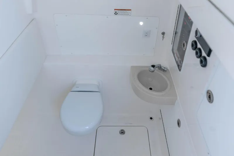 Slide: The Image of Manufacturer Provided Image: 2023 Invincible 39 Open Fisherman boat bathroom with toilet and sink. - 30