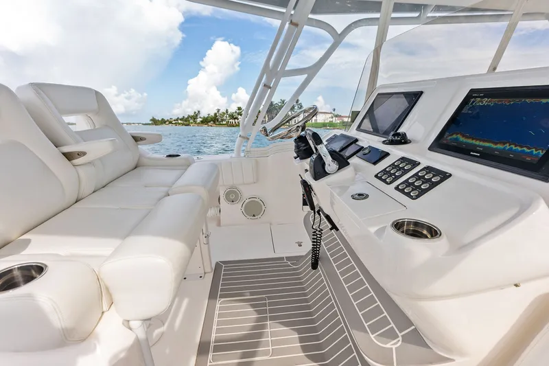 Slide: The Image of Luxurious 2019 Intrepid 400 Cuddy boat interior with advanced navigation systems. - 14