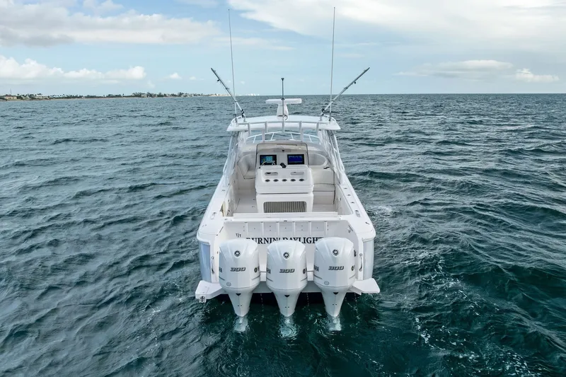 Slide: The Image of 2019 Intrepid 400 Cuddy boat with triple engines on open sea. - 8