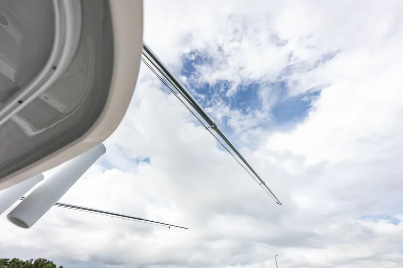 Slide: The Image of 2019 Intrepid 400 Cuddy boat with outriggers against a cloudy sky. - 21