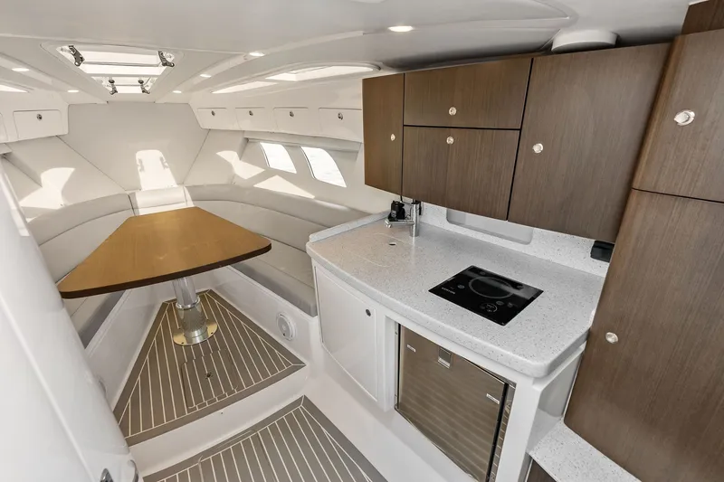 Slide: The Image of Luxurious interior of 2019 Intrepid 400 Cuddy boat with modern kitchen and seating area. - 41
