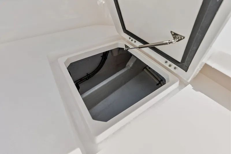 Slide: The Image of Open storage compartment on 2019 Intrepid 400 Cuddy boat deck. - 35