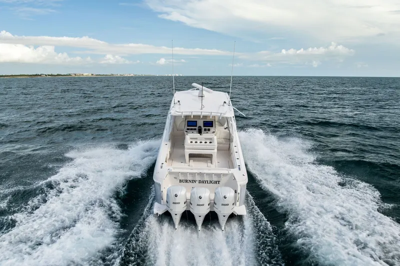 Slide: The Image of 2019 Intrepid 400 Cuddy cruising on open ocean, rear view. - 3