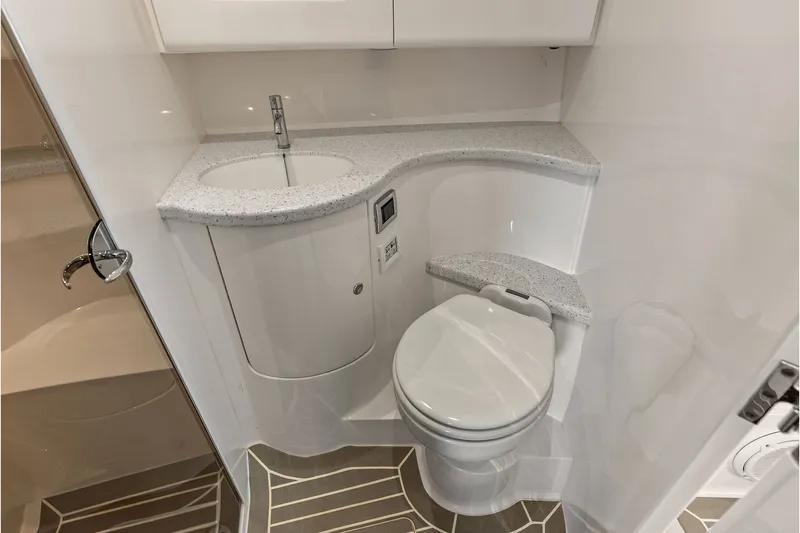 Slide: The Image of Luxurious bathroom in 2019 Intrepid 400 Cuddy boat with modern fixtures and sleek design. - 51
