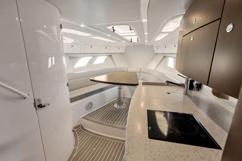 Slide: The Image of Luxurious interior of 2019 Intrepid 400 Cuddy boat with modern kitchen and seating area. - 47
