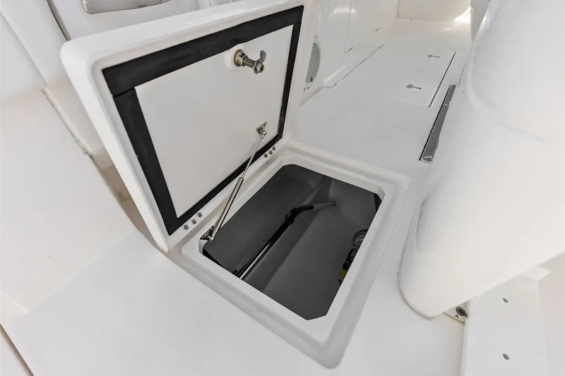 Slide: The Image of Open storage compartment on 2019 Intrepid 400 Cuddy boat deck. - 34