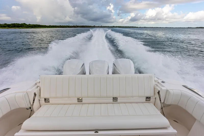 Slide: The Image of 2019 Intrepid 400 Cuddy cruising on open water, showcasing powerful engines and sleek design. - 23