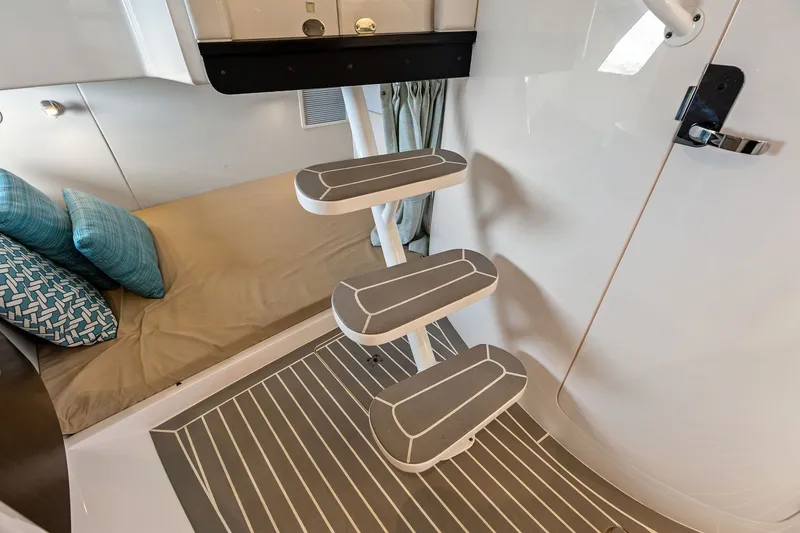 Slide: The Image of Interior of 2019 Intrepid 400 Cuddy with steps and cozy bedding. - 45