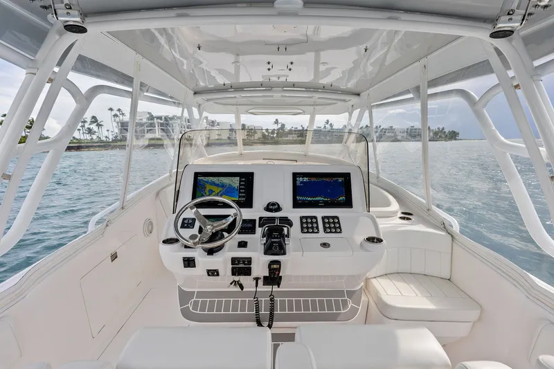 Slide: The Image of Cockpit of 2019 Intrepid 400 Cuddy boat with modern navigation equipment. - 11
