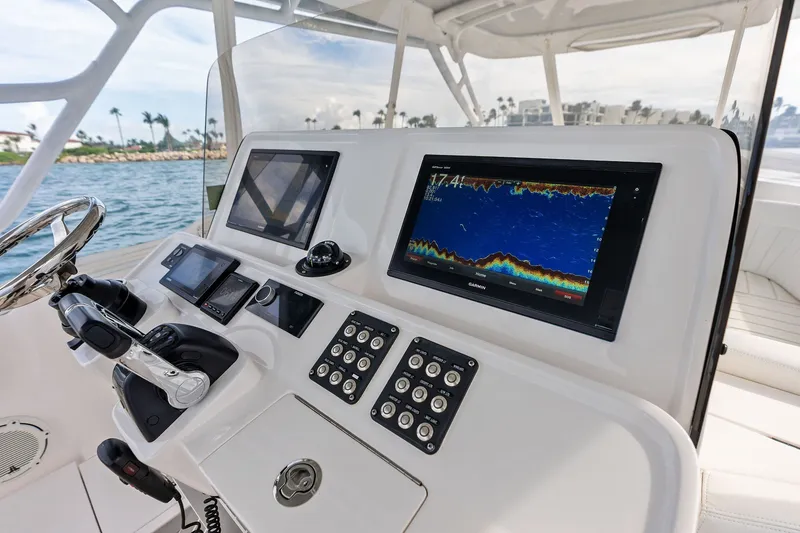 Slide: The Image of Control panel of a 2019 Intrepid 400 Cuddy boat with navigation screens. - 13