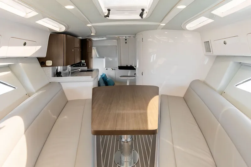 Slide: The Image of Luxurious interior of 2019 Intrepid 400 Cuddy with elegant seating and modern kitchenette. - 48
