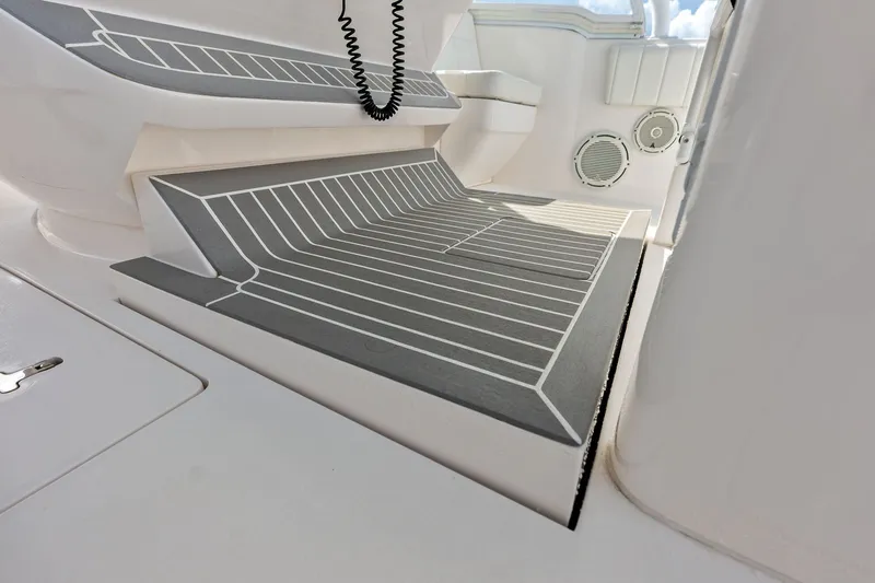 Slide: The Image of Interior view of 2019 Intrepid 400 Cuddy boat with sleek, modern flooring design. - 32
