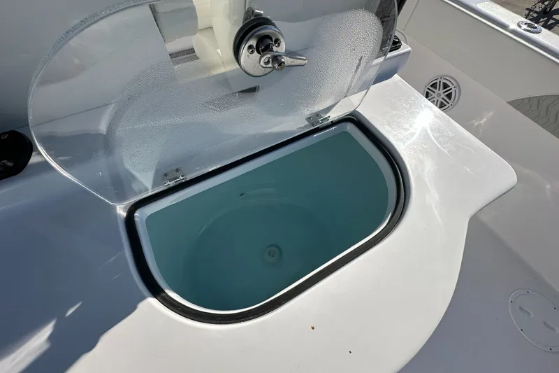 Slide: The Image of Livewell on 2026 Twin Vee 280 GFX2 CC boat, open lid, clear water inside. - 16