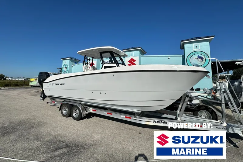 The Image of 2026 Twin Vee 280 GFX2 CC boat on trailer, powered by Suzuki Marine. - 0