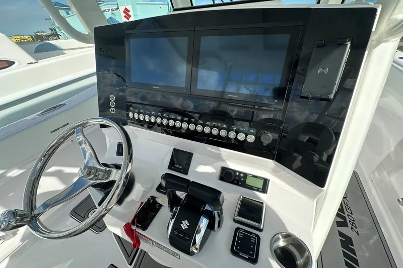 Slide: The Image of Helm of 2026 Twin Vee 280 GFX2 CC with dual screens and controls. - 4