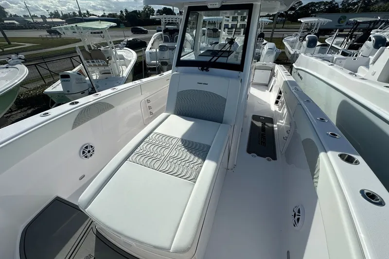 Slide: The Image of 2026 Twin Vee 280 GFX2 CC boat interior with cushioned seating and sleek design. - 6