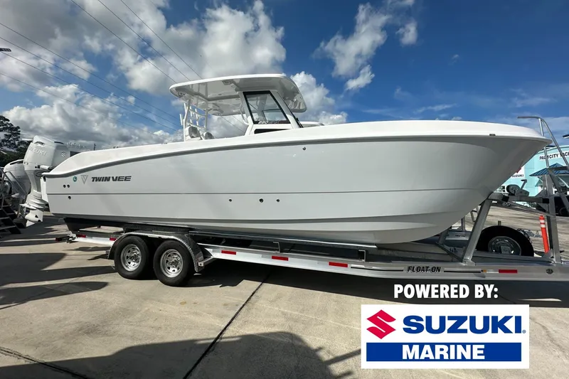 Slide: The Image of 2026 Twin Vee 280 GFX2 CC boat on trailer, powered by Suzuki Marine. - 0