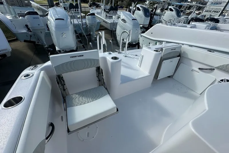 Slide: The Image of 2026 Twin Vee 280 GFX2 CC boat interior with seating and storage compartments. - 12